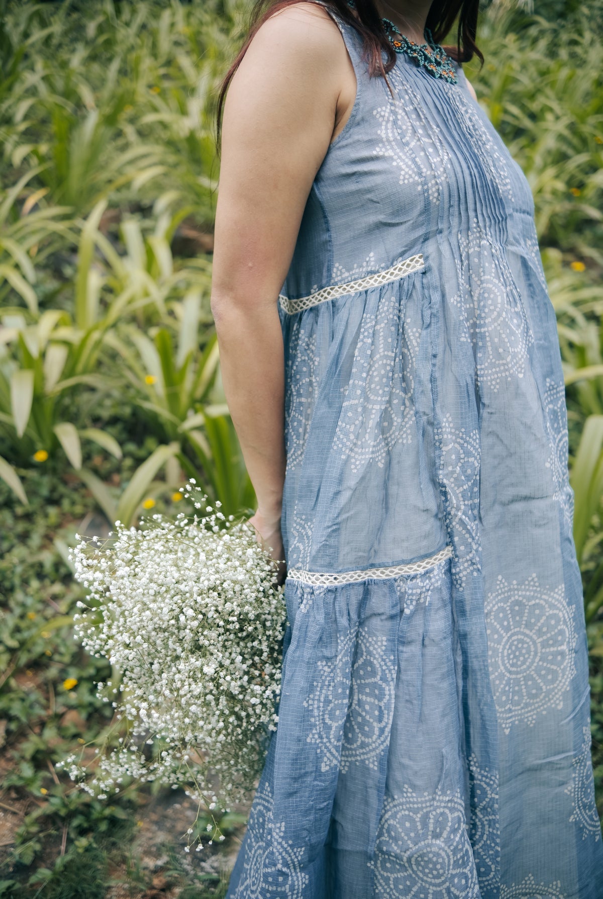 Blue sleeveless pleated yoke dress