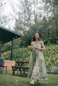 Green sleeveless pleated yoke dress
